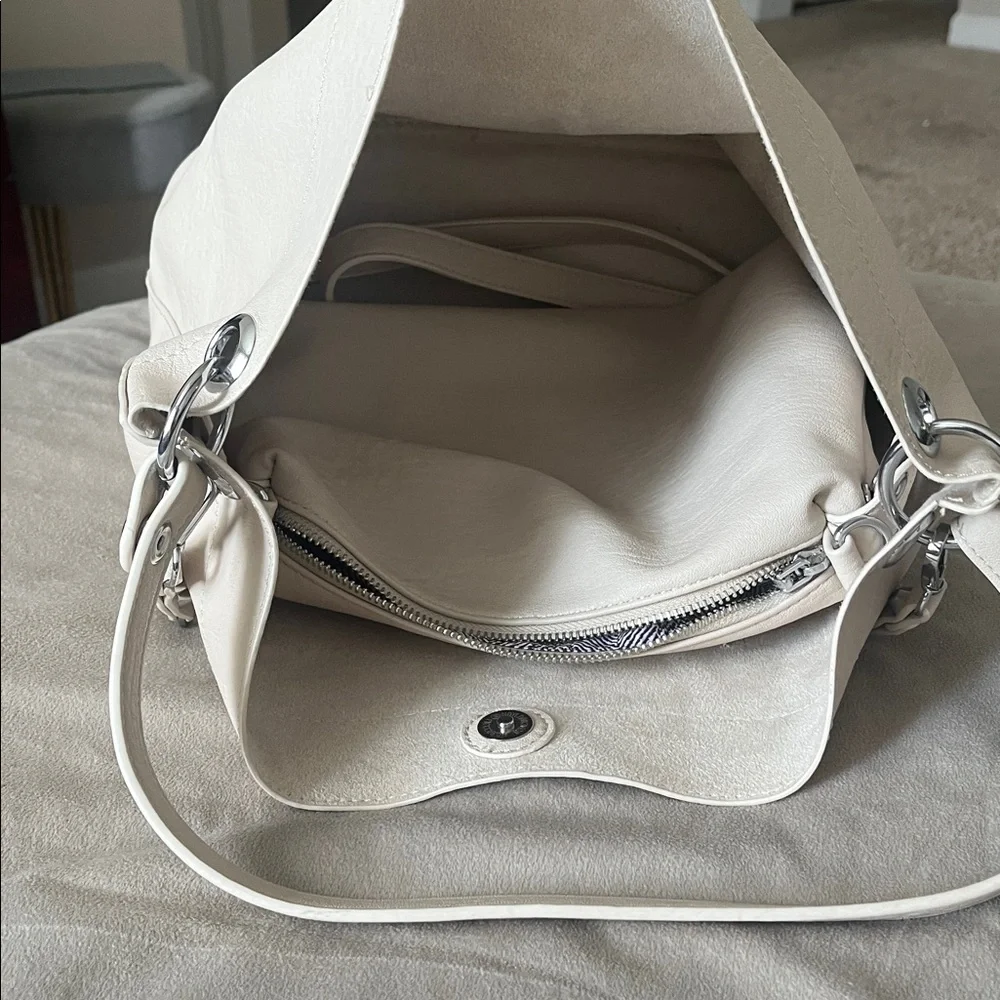 Madison West Purse in a purse
Cream purse w/ silver details. - Picture 3 of 6